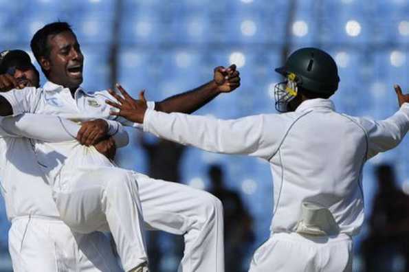 Bangladeshi cricketer Shahriar Nafees (left) lifts teammate Elias Sunny as they celebrate with Raqibul Hasan (right) after the dismissal of West Indies batsman Kirk Edwards during the fourth day of the first cricket Test match in Chittagong on October 24. Sunny made a memorable seven-wicket debut against the West Indies in the rain-hit opening Test, which ended in a draw. Bangladeshi cricketer Shahriar Nafees (left) lifts teammate Elias Sunny as they celebrate with Raqibul Hasan (right) after the dismissal of West Indies batsman Kirk Edwards during the fourth day of the first cricket Test match in Chittagong on October 24. Sunny made a memorable seven-wicket debut against the West Indies in the rain-hit opening Test, which ended in a draw.