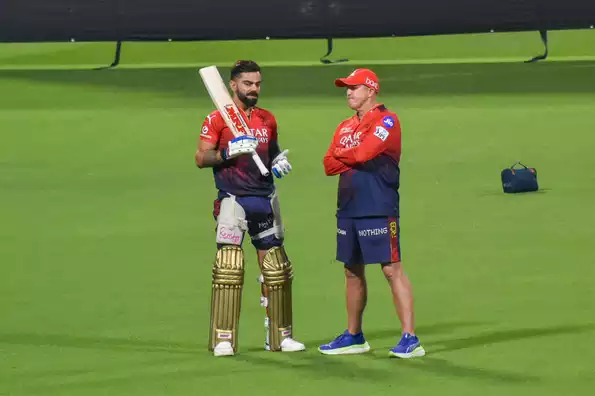 Virat Kohli and Andy Flower in discussion during practice at the Eden Gardens Virat Kohli and Andy Flower in discussion during practice at the Eden Gardens